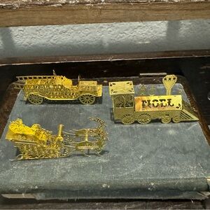 Vintage solid brass Christmas vehicles